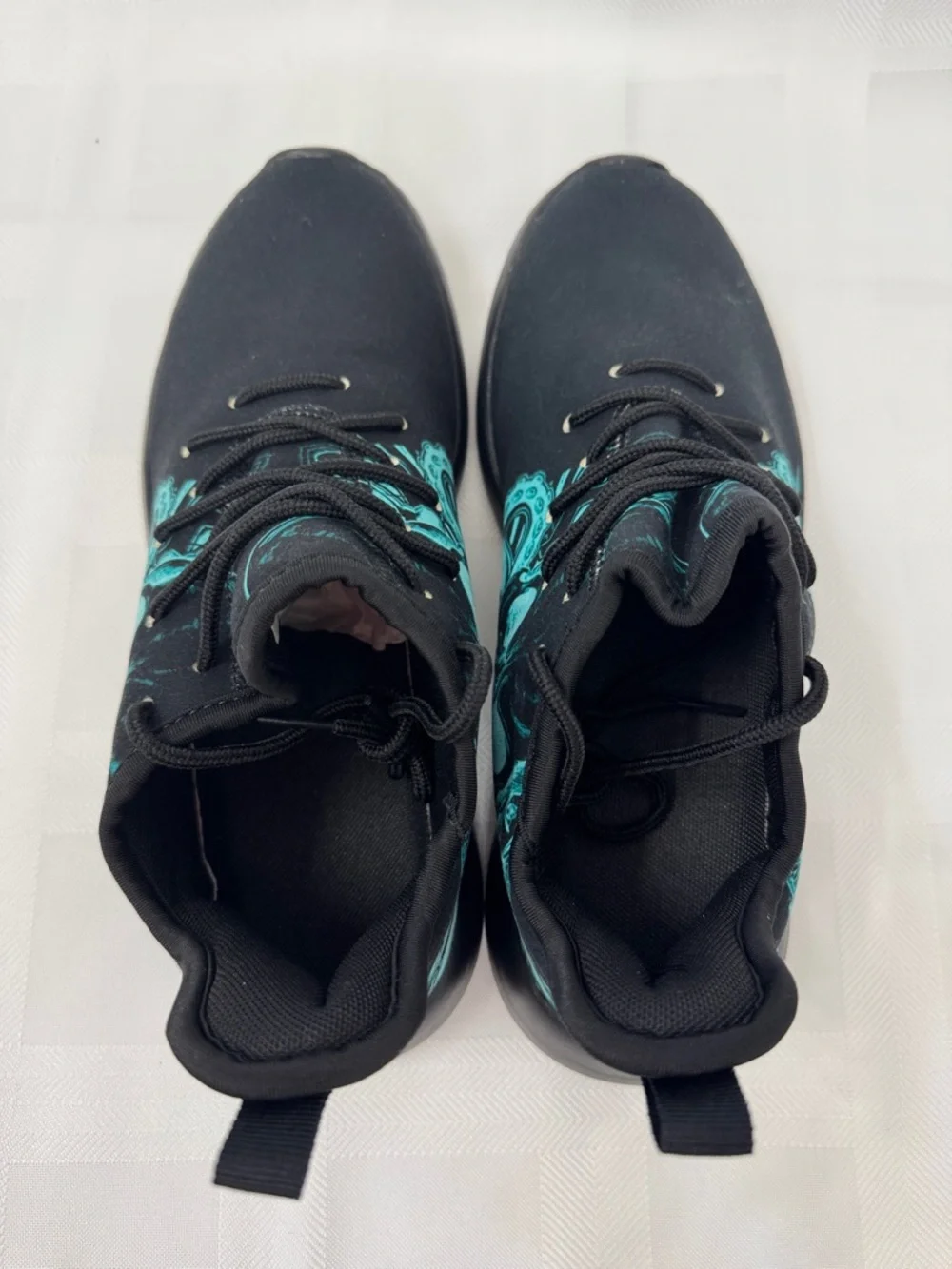 Unisex Black Lightweight Sneakers with Teal Skull Accent